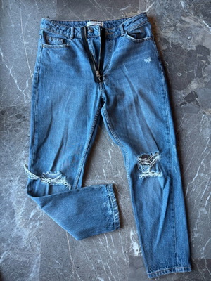Women's blue jeans with rips and unique zipper like new