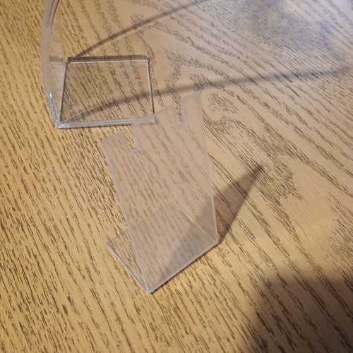 Jewelry stands used, one large transparent and one small matte