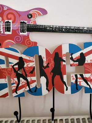 Wooden hanger with guitar design like new