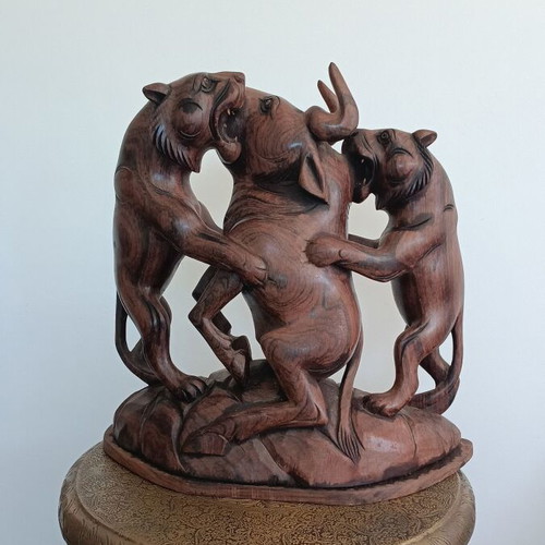 Hunting scene with buffalo and predators wood carving