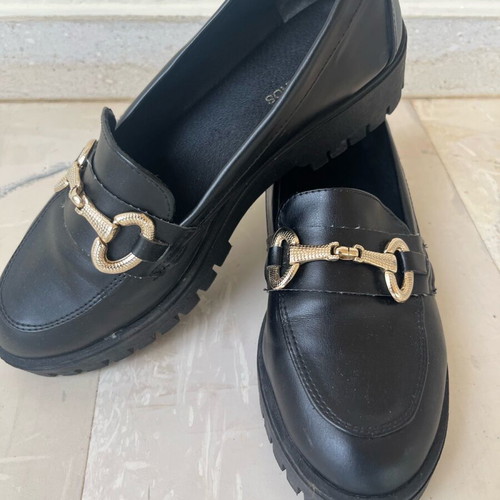 Tsouderos moccasins like new with gold detail and lug sole