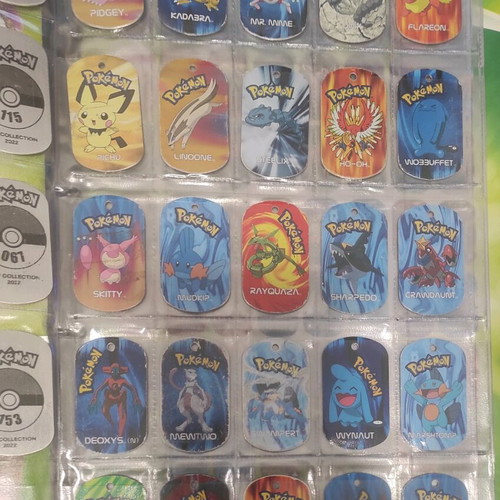Pokemon metal tags album used with 25 authentic 2006 tags