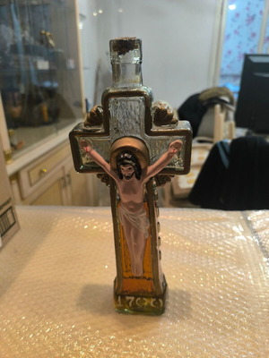 Glass decorative bottle in cross shape like new