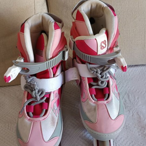 Roller skates used, size 33-36 with helmet and protective gear