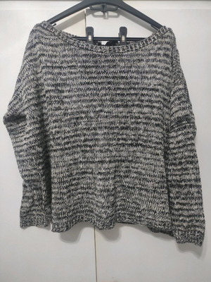 Women's knitted sweater with silver thread and satin ribbon on back