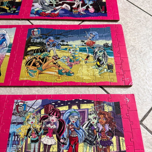 Monster High puzzle set like new, 9 glued on wood