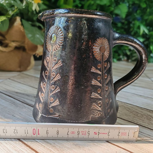 Retro ceramic milk jug with embossed flowers