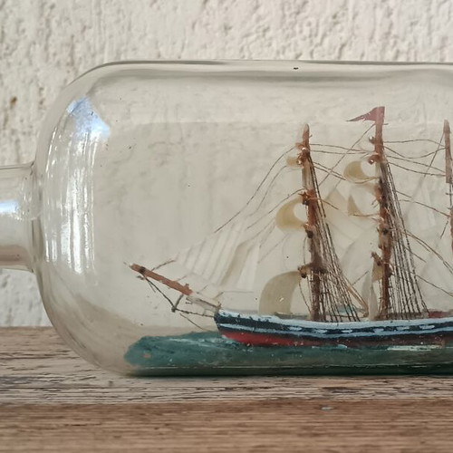 Vintage decorative ship in glass bottle used