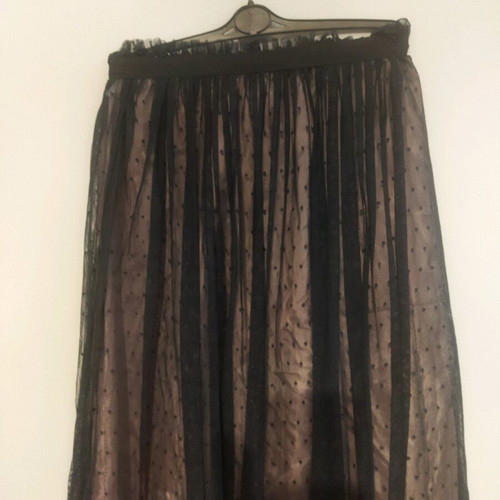 Skirt used with tulle on satin salmon base and black polka dots