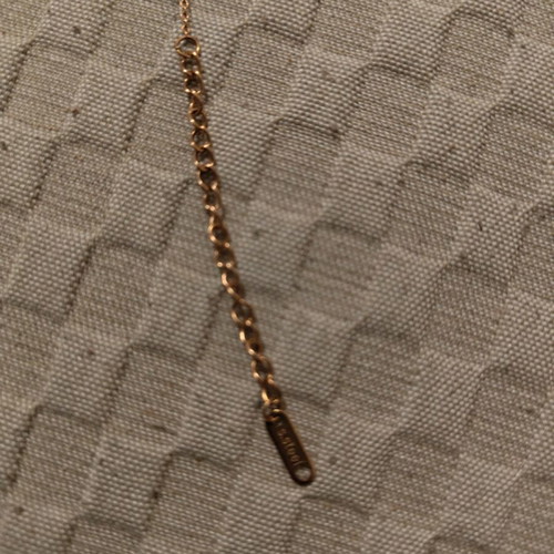 Steel bracelet gold color like new with red and white stones