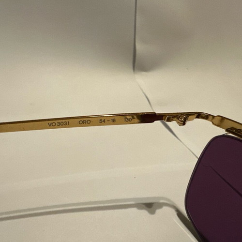 Vogue vintage sunglasses with gold metal frame and purple lenses, new