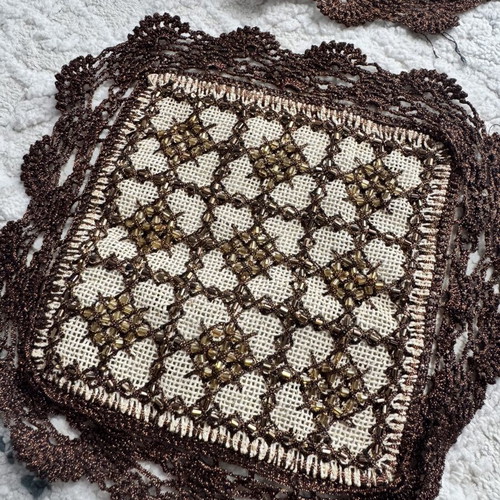 Vintage coasters used with lace and decorative beads in brown-bronze