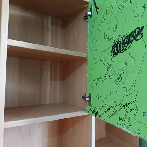 Desk with bookshelf and multiple storage spaces used