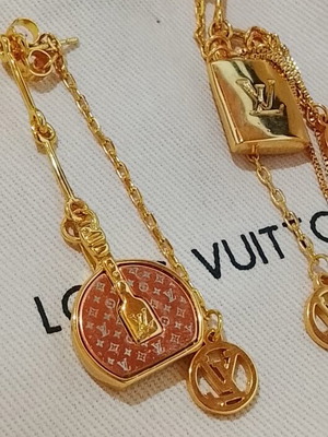 Louis Vuitton stainless steel earrings, rare sold out design, gold tone