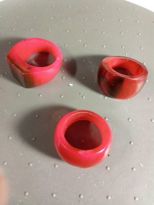 Three fuchsia celluloid rings like new, sizes 8.5, 8.75 and 7.5