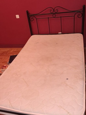 Metal single bed with mattress, black frame