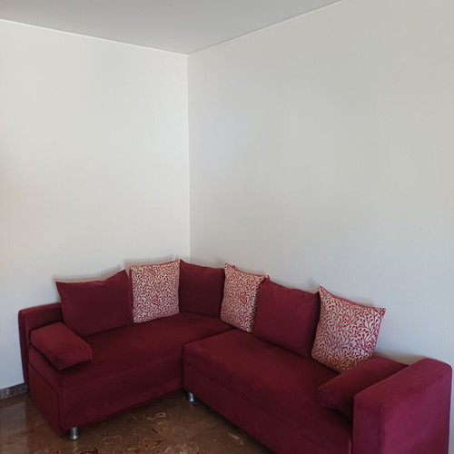 Corner sofa bed like new, burgundy with storage and cushions