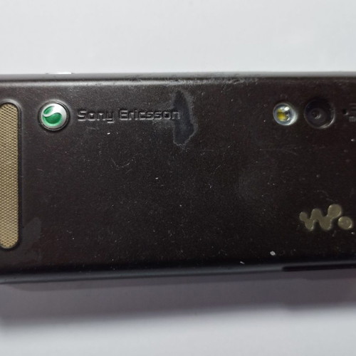 Sony Ericsson W715i mobile phone used, functional, with charger and headphones