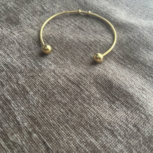 Handcuff bracelet like new, gold color