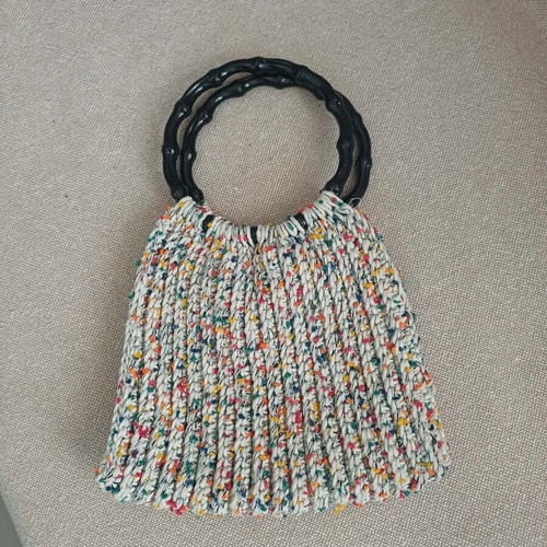 Handmade knitted bag with colorful details