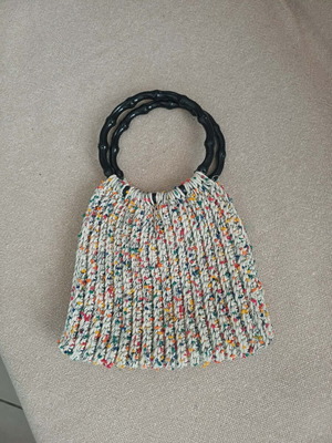 Handmade knitted bag with colorful details