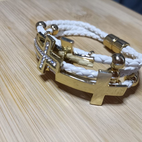 White and gold women's bracelet with rhinestones