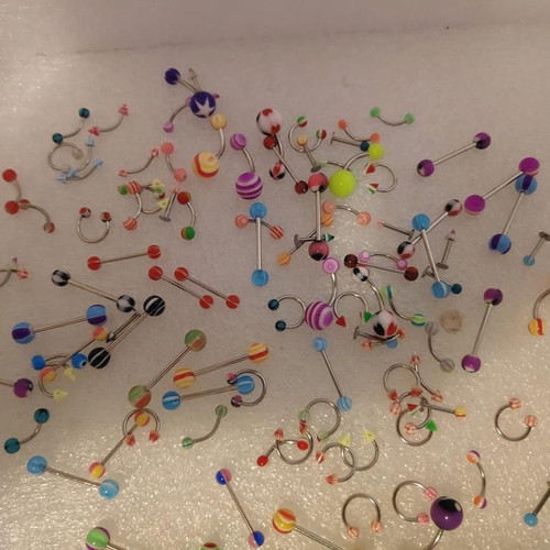 Piercing earrings set like new, 100 pieces, various designs and colors