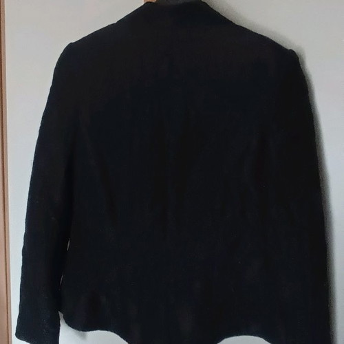 Black jacket used with shiny fabric