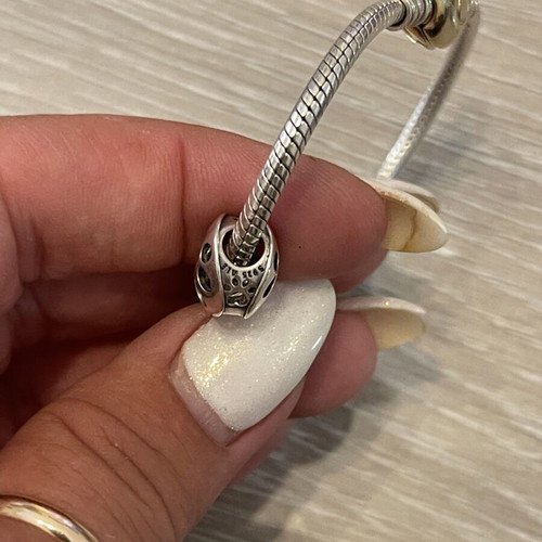 Pandora bracelet 925 silver with gold-plated clasp and two charms, used, 17 cm