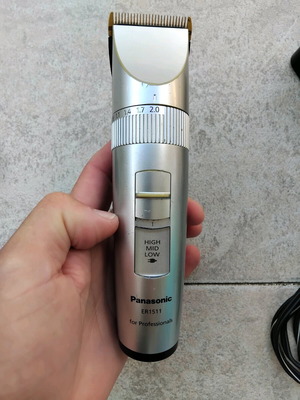 Panasonic ER1511 professional hair clipper with charger and combs