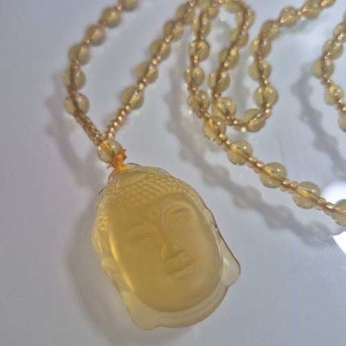 Buddha Necklace new, yellow sun color
