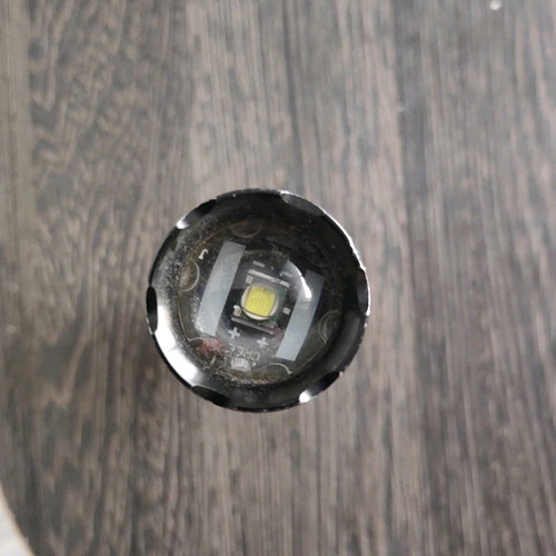 Led flashlight with focus beam capability used (zoom)