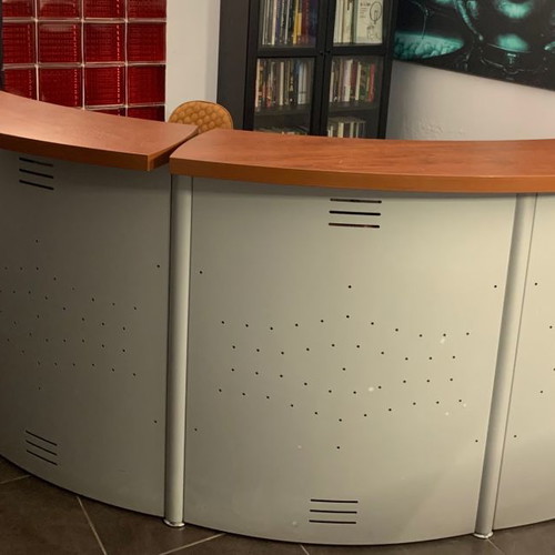 Reception desk used with metal perforated front panel