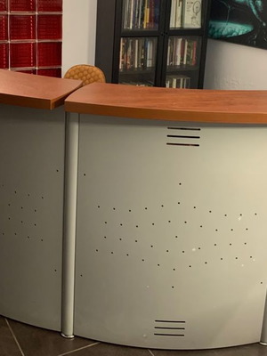 Reception desk used with metal perforated front panel