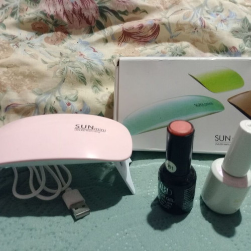 Gel Nail Dryer Machine with Pink Polish and Coat