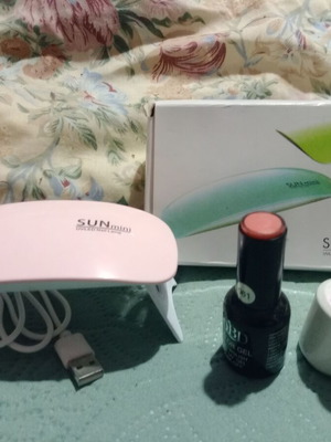 Gel Nail Dryer Machine with Pink Polish and Coat