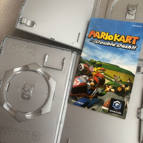 GameCube empty cases with Mario manual