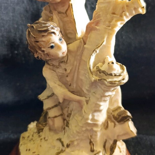 Vintage decorative figurine with children, used