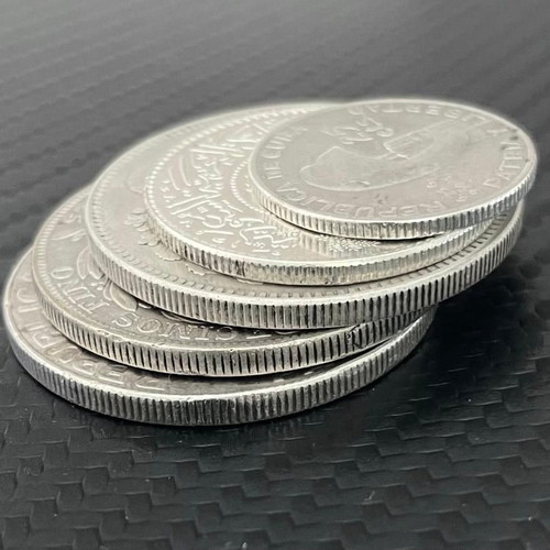 Silver coins from Cuba, Peru, Japan, Saudi Arabia