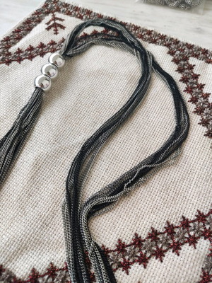 Long multi-strand lariat necklace with black and silver chains