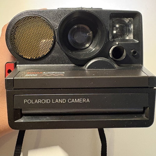 Polaroid Sonar AF 5000 instant camera with 8-frame film pack