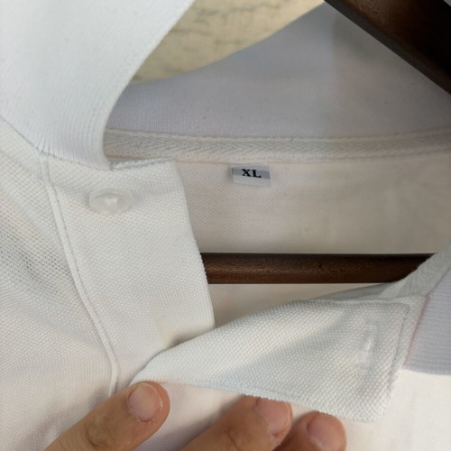 Two white polo shirts used, size XL, slight yellow stain on one