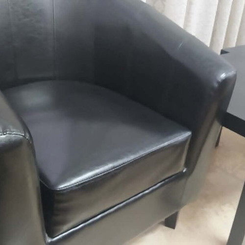 Black leatherette 2-seater sofa, 2 armchairs and 2 IKEA tables