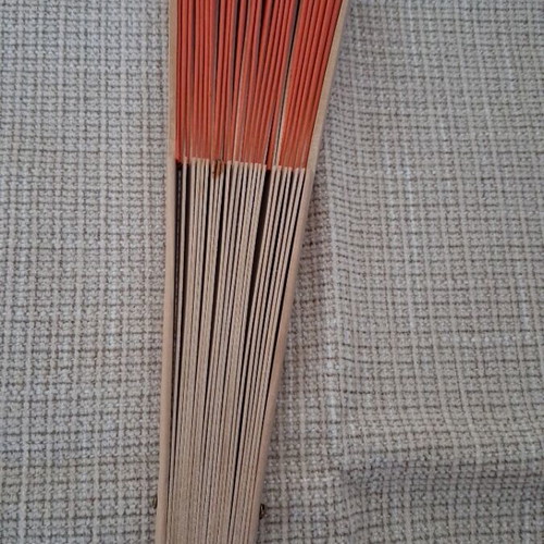 Fan refurbished with wooden base and orange fabric