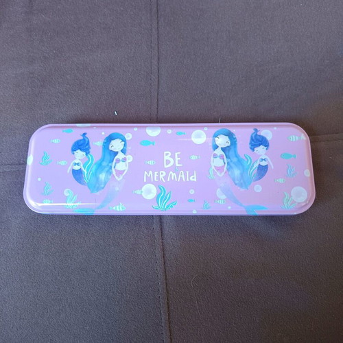 Metal pencil case with colored pencils used