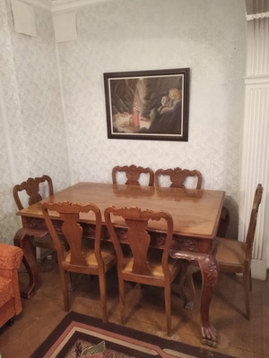 Antique wooden dining table with chairs