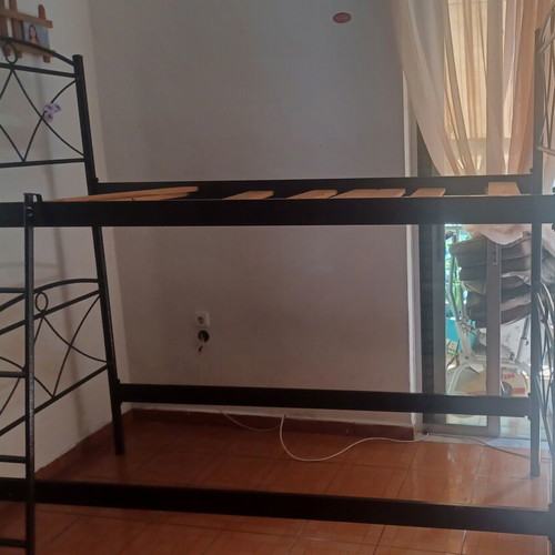 Metal bunk beds with ladder and slats