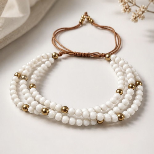 Triple bracelet with white beads and gold details new