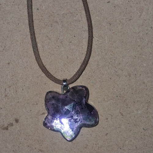 Swarovski vintage flower pendant with brown cord like new