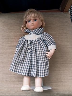 Porcelain doll used with stand, 33 cm tall